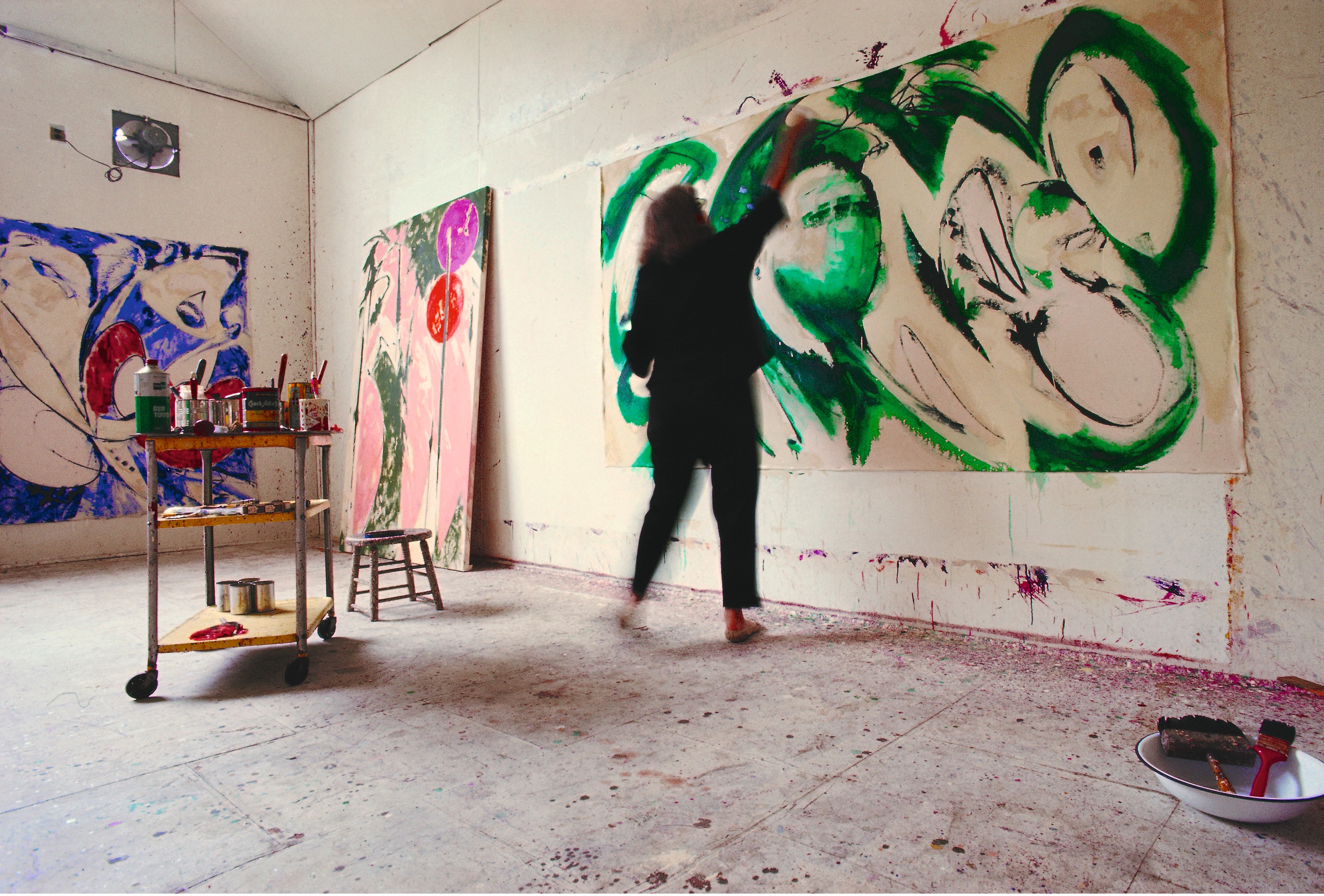 Lee Krasner painting Portrait in Green in her studio in Springs, 1969. Photograph by Mark Patiky.